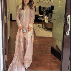 A Vision of Confidence in a Stylish Pink Suit